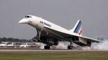 An image of a supersonic passenger aircraft, Concorde, on final landing approach with its unique nose fully drooped by 12.5 degrees and a high angle of attack.