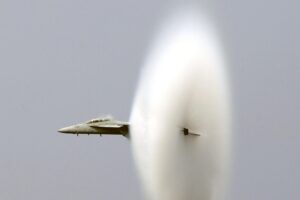 Mach number illustration showing aircraft speed compared with the local speed of sound and shock waves